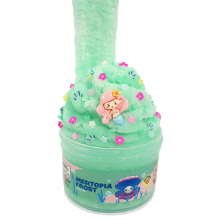 Peachybbies Icee Slime - Mertopia Frost
A mint green slime toy in a clear plastic tub labeled 'MERTOPIA FROST', topped with a tall column of matching slime, pink star sprinkles, seashell decorations, and a small mermaid figurine on a white background.