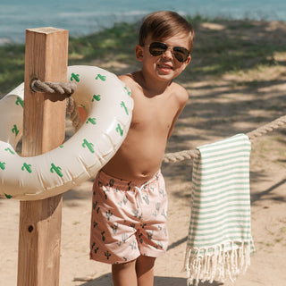 Petit Lem coral swim trunks with cactus print, featuring a comfortable fit and vibrant design for kids' swimwear.