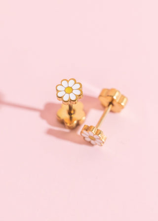 Pierced Co. White Tiny Daisy EarringsGold daisy earrings on a pink background