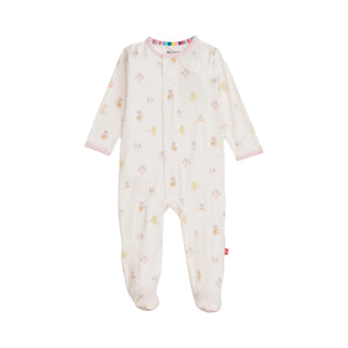 Magnetic Me Pink Baby Beats Modal Footie Baby onesie with floral pattern on a white background