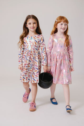 Pink Chicken Girls Lame Steph Dress - Pink Spider Web
Two young girls wearing colorful dresses holding a black bucket on a plain background