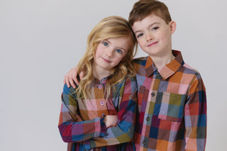 Blue Rooster Boys Jack Shirt - Harvest Check
Two children wearing colorful plaid shirts against a plain background