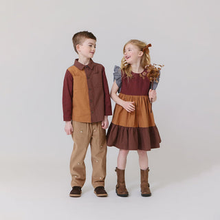 Blue Rooster Boys Jack Shirt - Mixed Checks
Two children wearing matching brown and red outfits on a white background