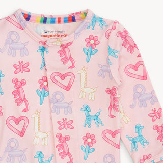 Magnetic Me Pink Party Animals Glow In The Dark Mod Footie
Children's pink long-sleeve shirt with colorful balloon animal and heart patterns on a white background.