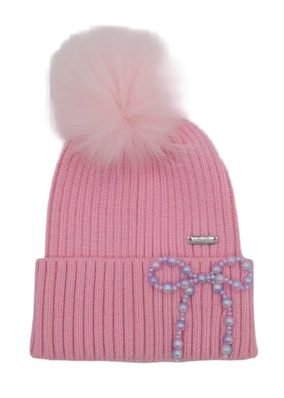 Bari Lynn Beanie with Pearl Bow - Pink
Pink knit beanie with a decorative bow and fluffy pom-pom on a light gray background