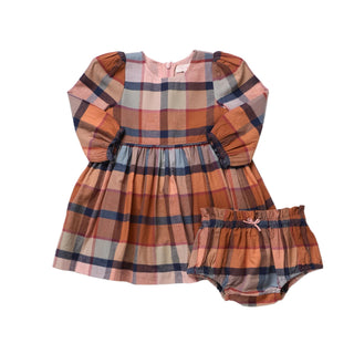 Pink Chicken Baby Girls Mae Dress Set - Hayride Plaid
A toddler girl's plaid dress and matching bloomers set laid flat on a white background. The dress has long puff sleeves, a gathered waist, and a plaid pattern in rust orange, dusty pink, navy blue, and beige.