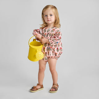 Pink Chicken Baby Girls Wynne Bubble - Multi Flower Drop
Child holding a yellow bucket against a plain background