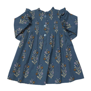 Pink Chicken Girls Jaipur Dress - Balsam Dewdrop
Pink Chicken Girls Jaipur Dress - Balsam Dewdrop
A toddler's long-sleeve dress in slate blue with a delicate floral and botanical print in muted purple, brown, and cream. The dress features a smocked bodice, a buttoned placket with blue buttons, and ruffled shoulders, laid flat against a light gray background.