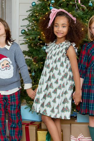 Pink Chicken Girls Stevie Dress - Vintage Trees
Children in festive clothing standing in front of a decorated Christmas tree.