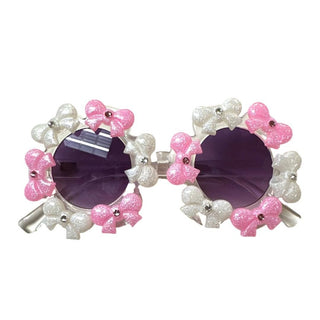 Pink and White Bari Lynn Crystallized Bow Charm Sunglasses
Sunglasses with pink and white floral design on a white background