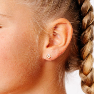 Pip Pop Post Earrings - Donut Stud
Close-up of an ear wearing a small earring with braided hair.