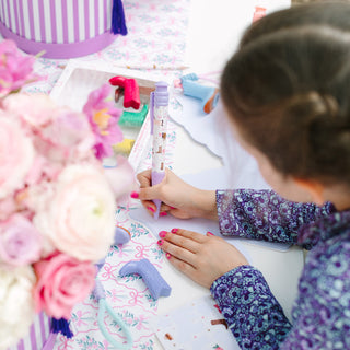 Jollity & Co Pony Tales Jumbo Pen Set
Child engaged in craft activity with colorful materials on a table