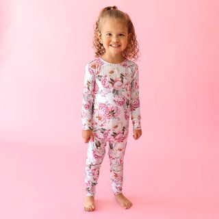 Posh Peanut Classic Pajama Set - Lucienne
Child wearing a floral onesie on a pink background