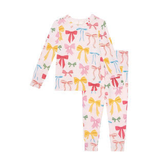 Posh Peanut Classic Pajama Set - Shawna
Children's outfit with colorful bow pattern on a white background
