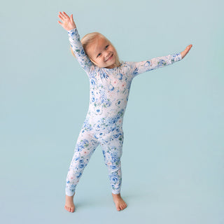 Posh Peanut Classic Pajama Set - Trista
Child wearing a floral onesie against a light blue background