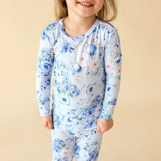 Posh Peanut Classic Pajama Set - Trista
Child wearing a floral pajama set on a beige background