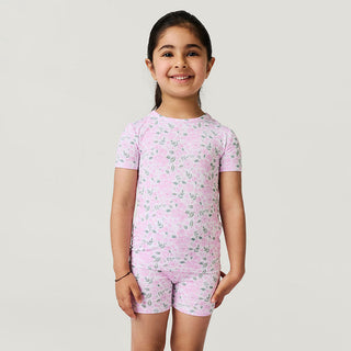 Posh Peanut Classic Pajama Short Set - Annabeth
Young girl wearing a pink floral pajama set on a plain background