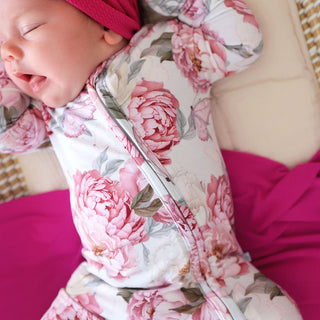 Posh Peanut Convertible One Piece - Lucienne
Baby wrapped in a floral swaddle with pink accents