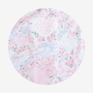 Posh Peanut Josephine
Round fabric swatch with pink floral and bow pattern on a white background