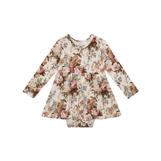 Posh Peanut Long Sleeve Twirl Bodysuit Dress - Dauphine
A long-sleeve baby dress with a vintage floral print in shades of pink, brown, and blue on a cream background, laid flat on a light gray background.