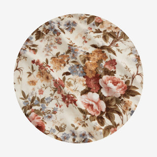 Posh Peanut Long Sleeve Twirl Bodysuit Dress - Dauphine
A circular fabric swatch featuring a vintage floral pattern with pink, red, blue, and yellow flowers on a cream background, with brown leaves and stems.