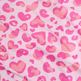 Posh Peanut Love Leopard
Pink and orange heart pattern on a pink background