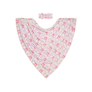 Posh Peanut Swaddle Headband Set - Harriet
A baby beach blanket and matching headband set in a pink and white floral print, displayed flat against a light gray background.