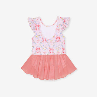 Posh Peanut Twirl Skirt Leotard - Harriet
A toddler girl's sleeveless top with ruffled flutter sleeves, featuring a light pink floral and bow patterned bodice and a contrasting coral pink tulle skirt, shown flat on a light gray background.