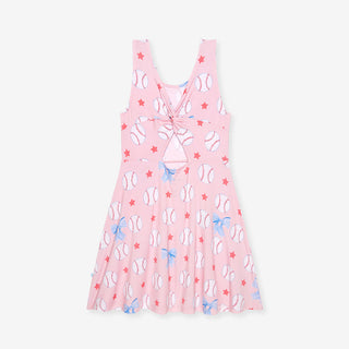 Posh Peanut Gina twist-back skater dress with short sleeves and floral pattern, displayed on a hanger.