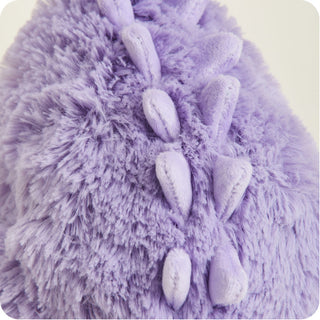 Purple Long Neck Dinosaur Warmies
Close-up of a fluffy purple dinosaur toy with white spikes.