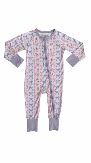 In My Jammers Zipper Romper - Purple Amelia Bow Baby onesie with bow pattern on a white background