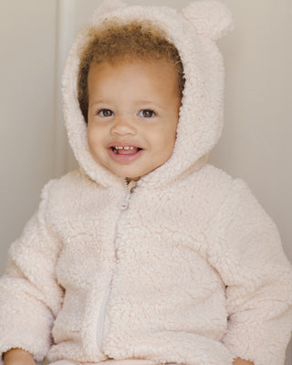 Quincy Mae Bear Jacket - Antique
Child wearing a fluffy white hooded jacket against a neutral background