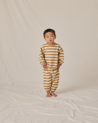 Quincy Mae Oversized Crew Sweatshirt & Oversized Sweatpant Set - Gold Stripe
Child wearing a striped outfit on a neutral background