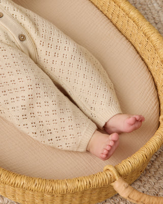 Quincy Mae Bubble Romper - Natural
Baby in a woven basket with a textured blanket