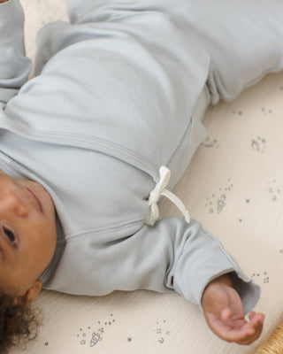 Quincy Mae sky-colored wrap top and matching pant set, casual outfit for babies or toddlers, styled in a cozy, lifestyle setting.