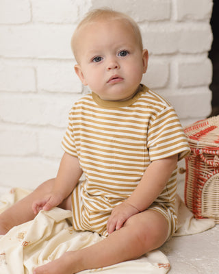 Quincy Mae Pocket Tee + Short Set - Honey Stripe
Baby wearing a yellow and white striped outfit sitting on a white blanket with a wicker basket in the background.
