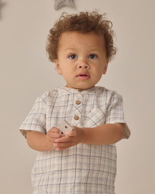 Quincy Mae Jaxson Shirt - Blue Plaid
Child wearing a plaid shirt holding a phone against a neutral background