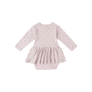 Quincy Mae Pointelle Skirted Bodysuit - Lilac
Pink baby dress with long sleeves on a white background