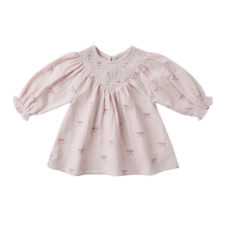 Quincy Mae V Smocked Dress - Bows
Pink baby dress with bow pattern on a white background