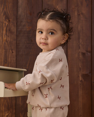 Quincy Mae velour relaxed sweatshirt and sweatpants set in red with bow details, cozy and stylish for children.