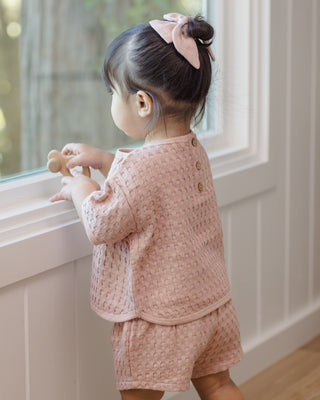 Quincy Mae Jayden 2-piece blush outfit for toddlers, featuring a comfortable matching top and pants, styled in a cozy, casual look.