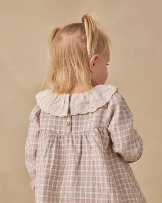 Quincy Mae Callie Dress in blue gingham fabric, featuring a classic sleeveless design for young girls.