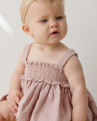 Quincy Mae mauve 2-piece smocked top and bloomer set for babies, featuring soft fabric and playful design.