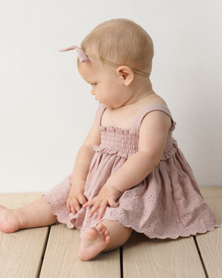 Quincy Mae mauve 2-piece smocked top and bloomer set for infants, featuring soft fabric and comfortable design.
