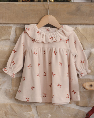 Red velour baby dress by Quincy Mae with bow details, featuring a soft, cozy fabric perfect for little ones.