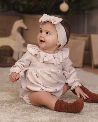 Red bows Quincy Mae Wendy romper for babies, featuring soft fabric and cute bow details, perfect for little ones.