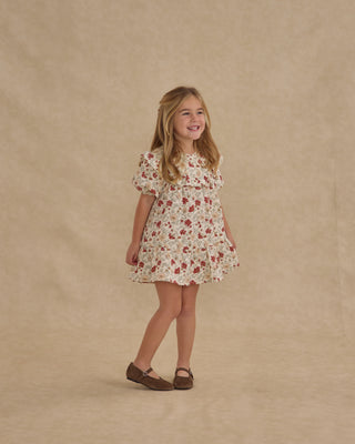 Rylee & Cru Cordelia Dress - Holiday Floral
Young girl wearing a floral dress against a beige background