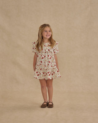 Rylee & Cru Cordelia Dress - Holiday Floral
Young girl wearing a floral dress against a beige background