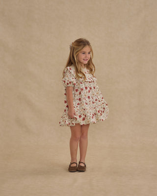 Rylee & Cru Cordelia Dress - Holiday Floral
Young girl wearing a floral dress against a beige background