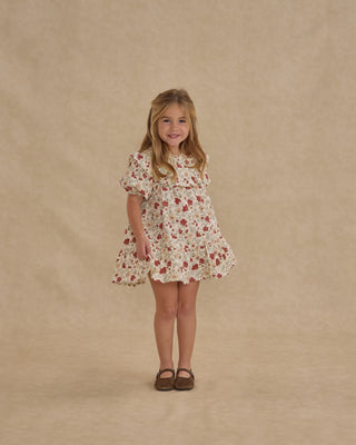 Rylee & Cru Cordelia Dress - Holiday Floral
Young girl wearing a floral dress against a beige background